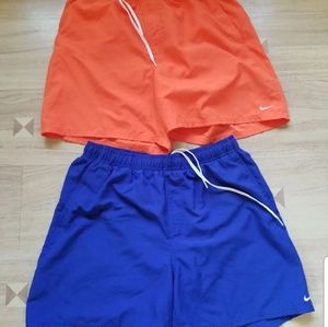Two men's Nike bathing suit